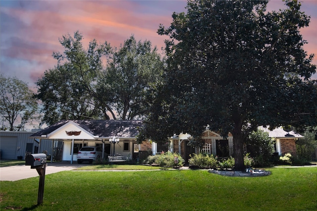 view of front of property featuring a lawn and covered porch