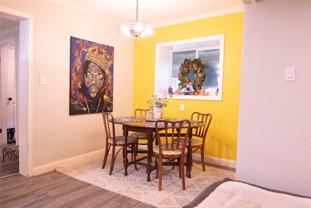 dining room featuring ornamental molding and hardwood / wood-style flooring