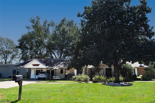 view of front of home featuring a front yard and a porch