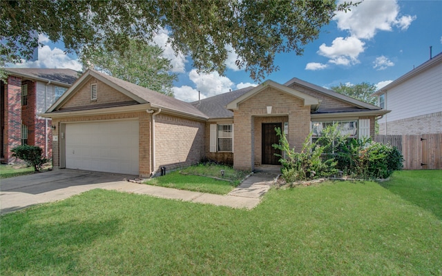 view of front of property with a front yard and a garage