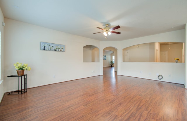 spare room with hardwood / wood-style floors and ceiling fan