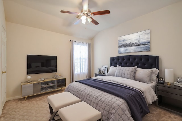 carpeted bedroom with vaulted ceiling and ceiling fan