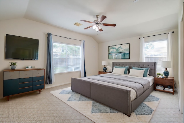 bedroom with light carpet, multiple windows, and ceiling fan