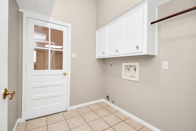 clothes washing area featuring washer hookup, light tile patterned floors, and hookup for a gas dryer