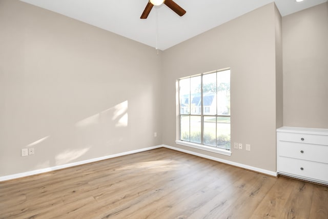 spare room featuring ceiling fan and light wood-type flooring