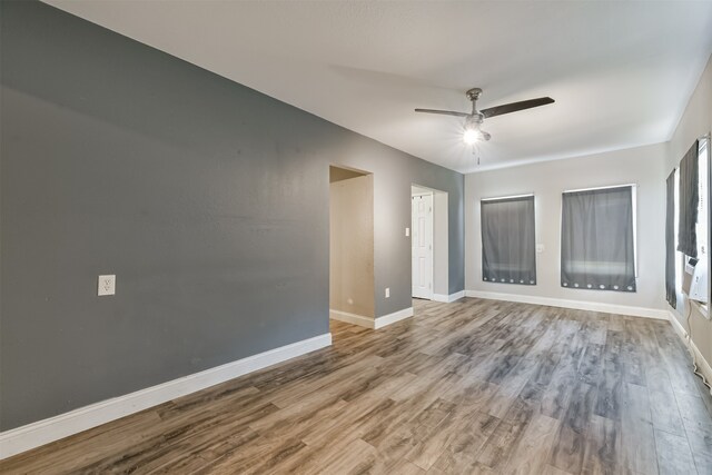 unfurnished room featuring ceiling fan and light wood-type flooring