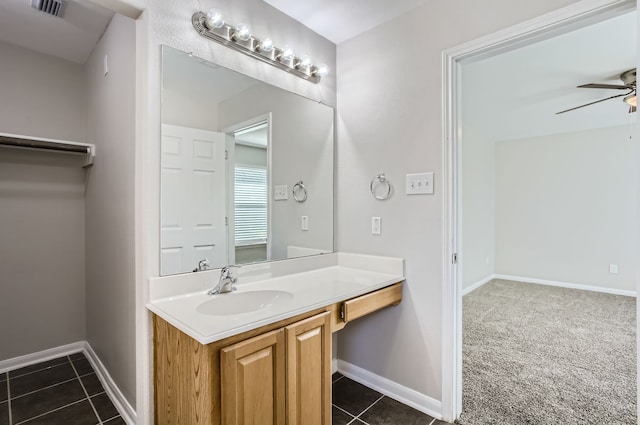 bathroom featuring tile patterned flooring, vanity, and ceiling fan