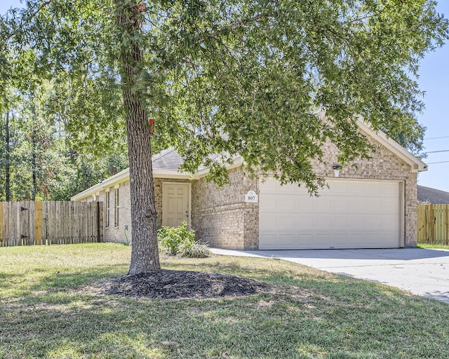 view of front facade featuring a front yard and a garage