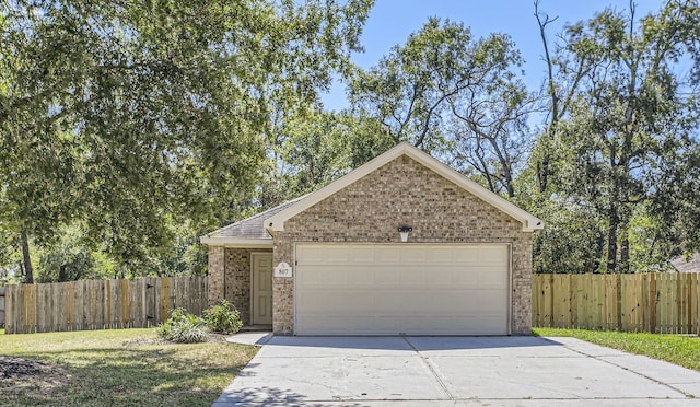 ranch-style home featuring a garage