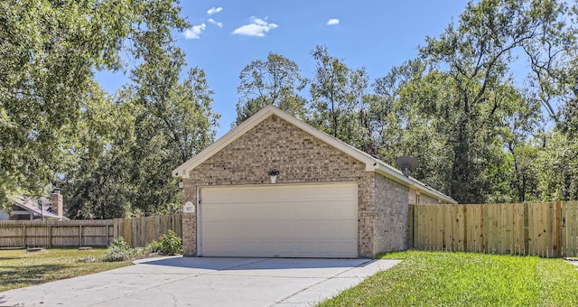 garage featuring a yard