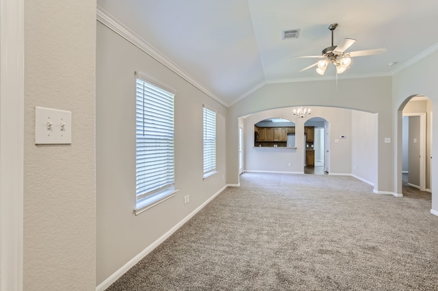 unfurnished living room featuring vaulted ceiling, ceiling fan, carpet flooring, and crown molding