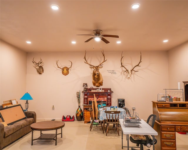 interior space with ceiling fan