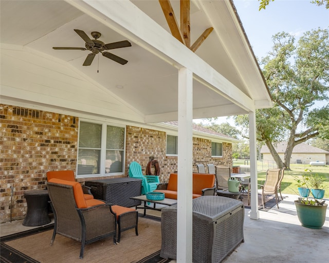 view of patio with an outdoor living space and ceiling fan