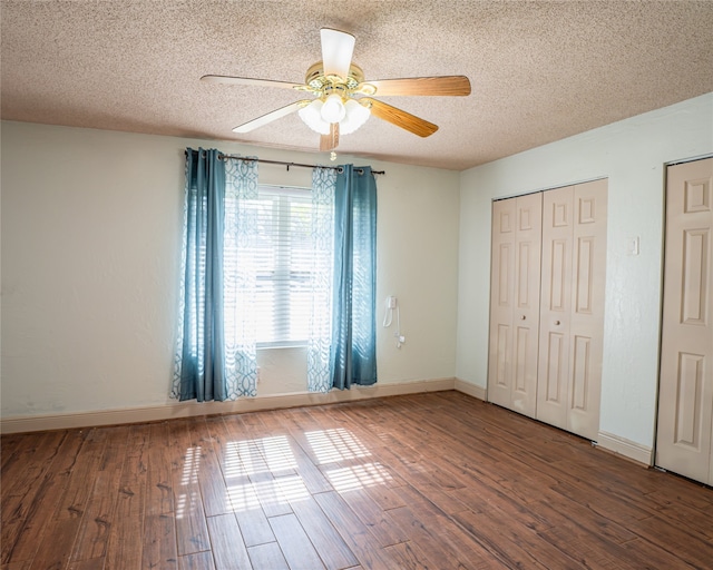 unfurnished bedroom with ceiling fan, hardwood / wood-style floors, and a textured ceiling