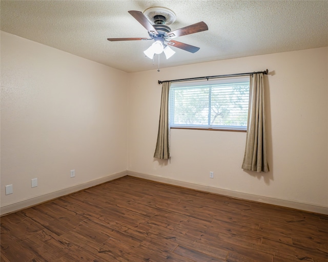 spare room featuring ceiling fan, a textured ceiling, and dark hardwood / wood-style flooring