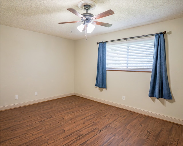 unfurnished room featuring ceiling fan, a textured ceiling, and dark wood-type flooring