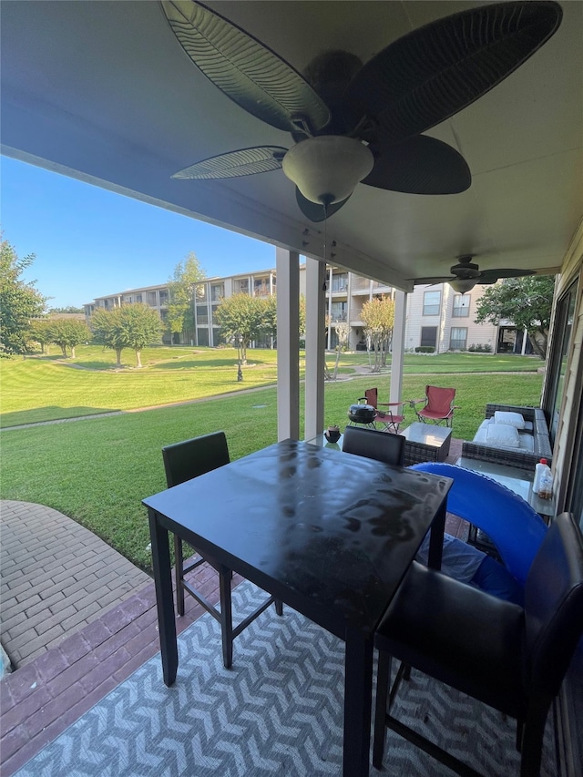 view of patio / terrace featuring ceiling fan