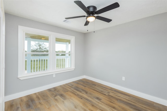 unfurnished room with hardwood / wood-style flooring and ceiling fan