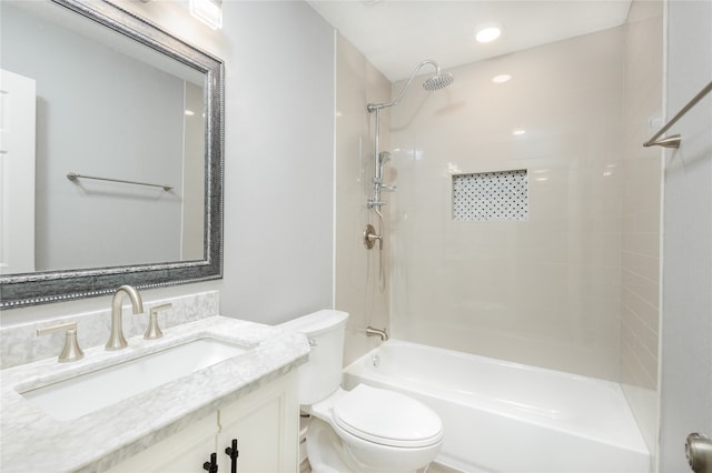 full bathroom with vanity, toilet, and tiled shower / bath