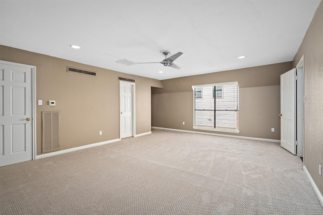 unfurnished bedroom featuring light carpet and ceiling fan