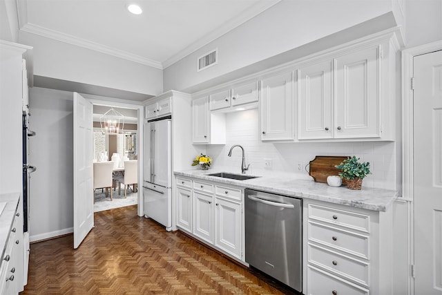 kitchen featuring sink, dishwasher, high end white refrigerator, dark parquet floors, and white cabinets