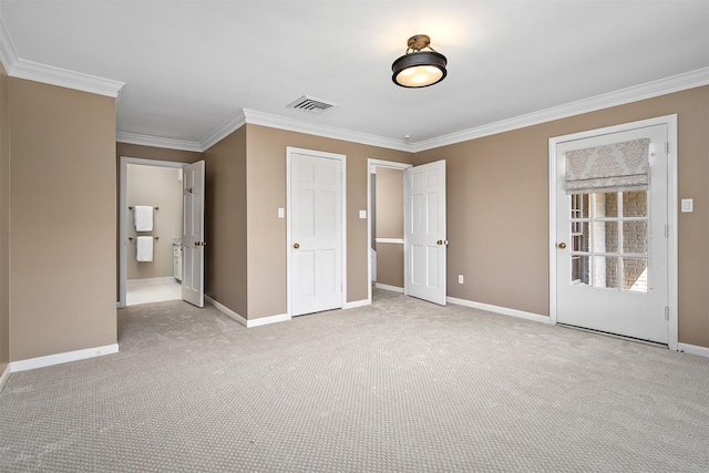 unfurnished bedroom with crown molding and light carpet