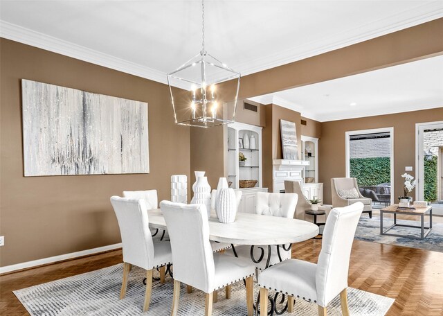 dining room featuring crown molding, dark parquet flooring, and a notable chandelier