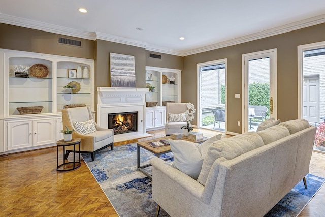 living room featuring ornamental molding and parquet floors