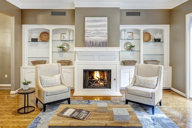 sitting room with ornamental molding and light parquet flooring