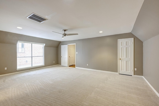 interior space featuring vaulted ceiling and ceiling fan