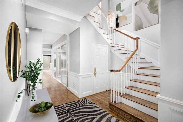 interior space featuring parquet floors and crown molding