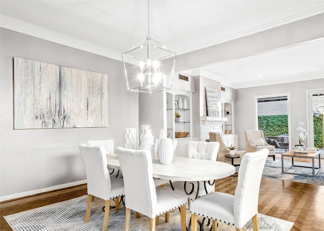 dining area featuring parquet floors, crown molding, and a notable chandelier