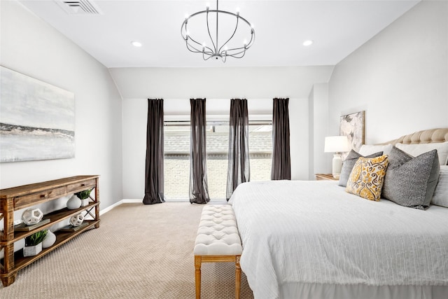 bedroom with an inviting chandelier, light colored carpet, and vaulted ceiling