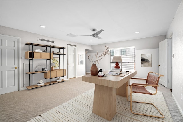 office with light colored carpet and ceiling fan