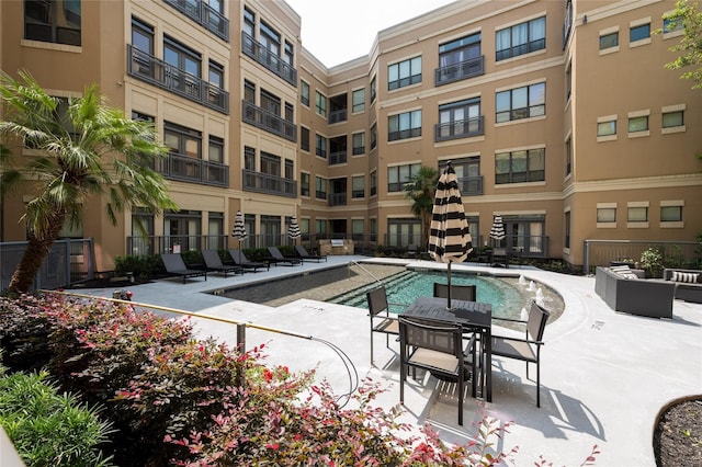 view of pool with outdoor lounge area and a patio area