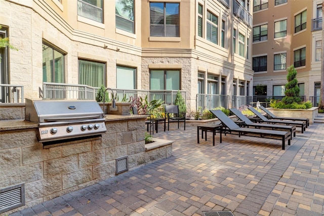 view of patio featuring area for grilling and an outdoor kitchen