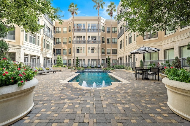 view of swimming pool featuring a patio