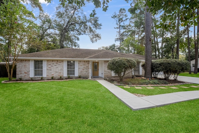 ranch-style home with a front lawn