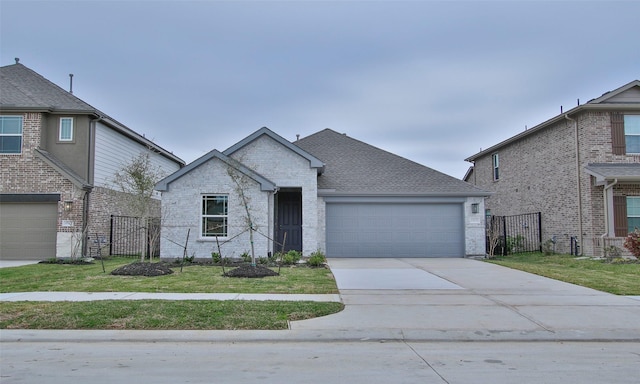 view of front of home with a front yard and a garage