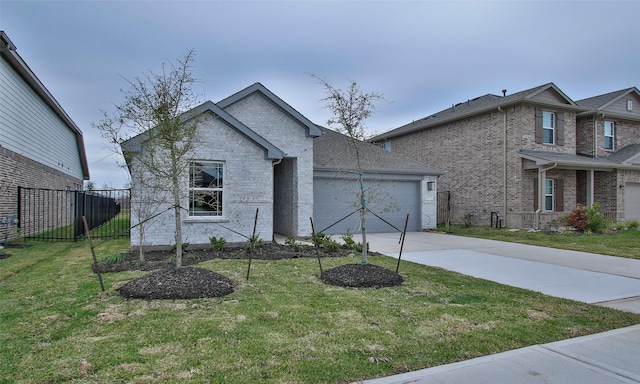 view of front of house with a garage and a front lawn