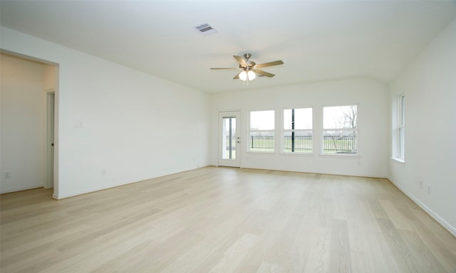 spare room featuring light hardwood / wood-style flooring and ceiling fan