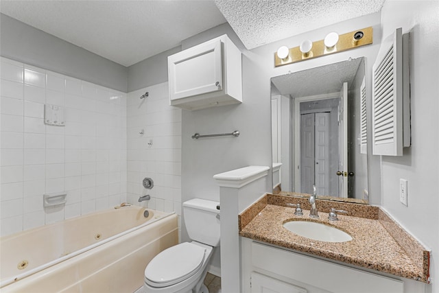 full bathroom featuring a textured ceiling, tiled shower / bath combo, vanity, and toilet