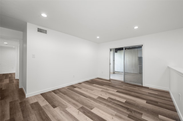 empty room featuring hardwood / wood-style flooring