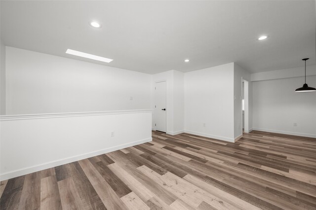 spare room with hardwood / wood-style floors