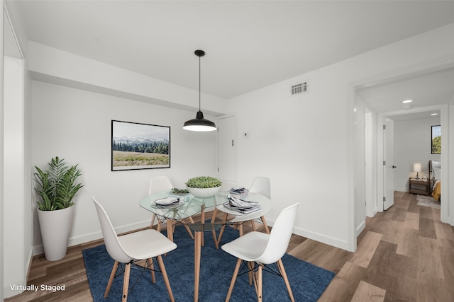 dining space featuring hardwood / wood-style flooring