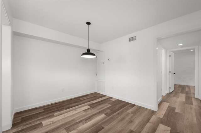 unfurnished dining area with hardwood / wood-style flooring