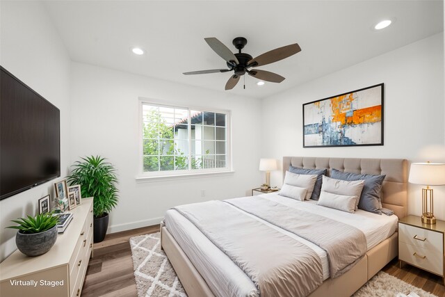 bedroom featuring light hardwood / wood-style flooring and ceiling fan