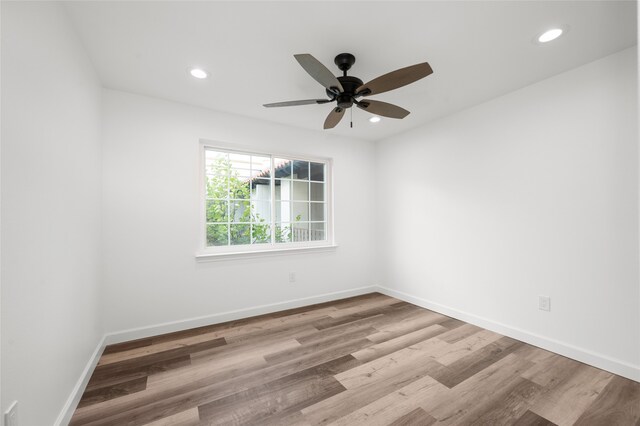 empty room featuring light hardwood / wood-style floors and ceiling fan