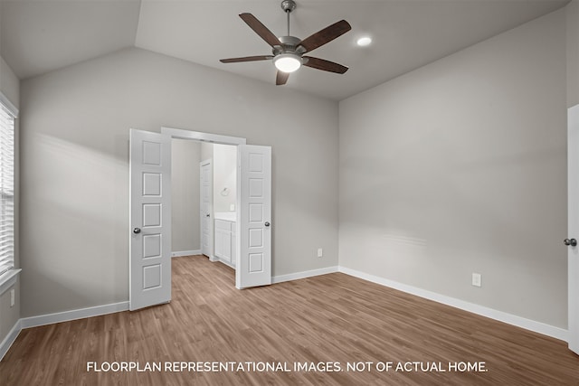 unfurnished bedroom featuring connected bathroom, light hardwood / wood-style floors, lofted ceiling, and ceiling fan