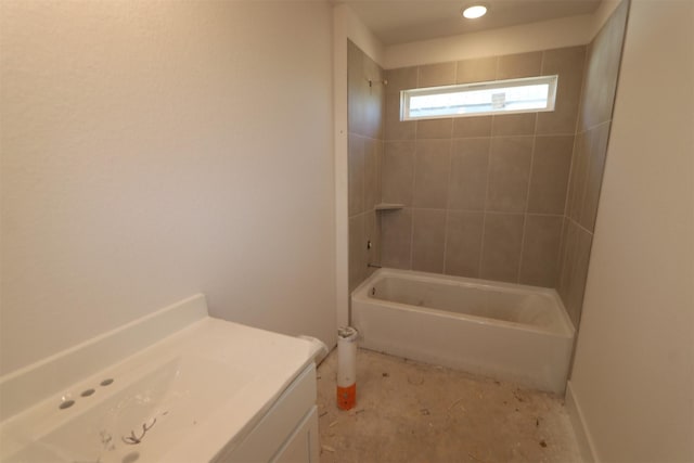 bathroom with vanity and tiled shower / bath